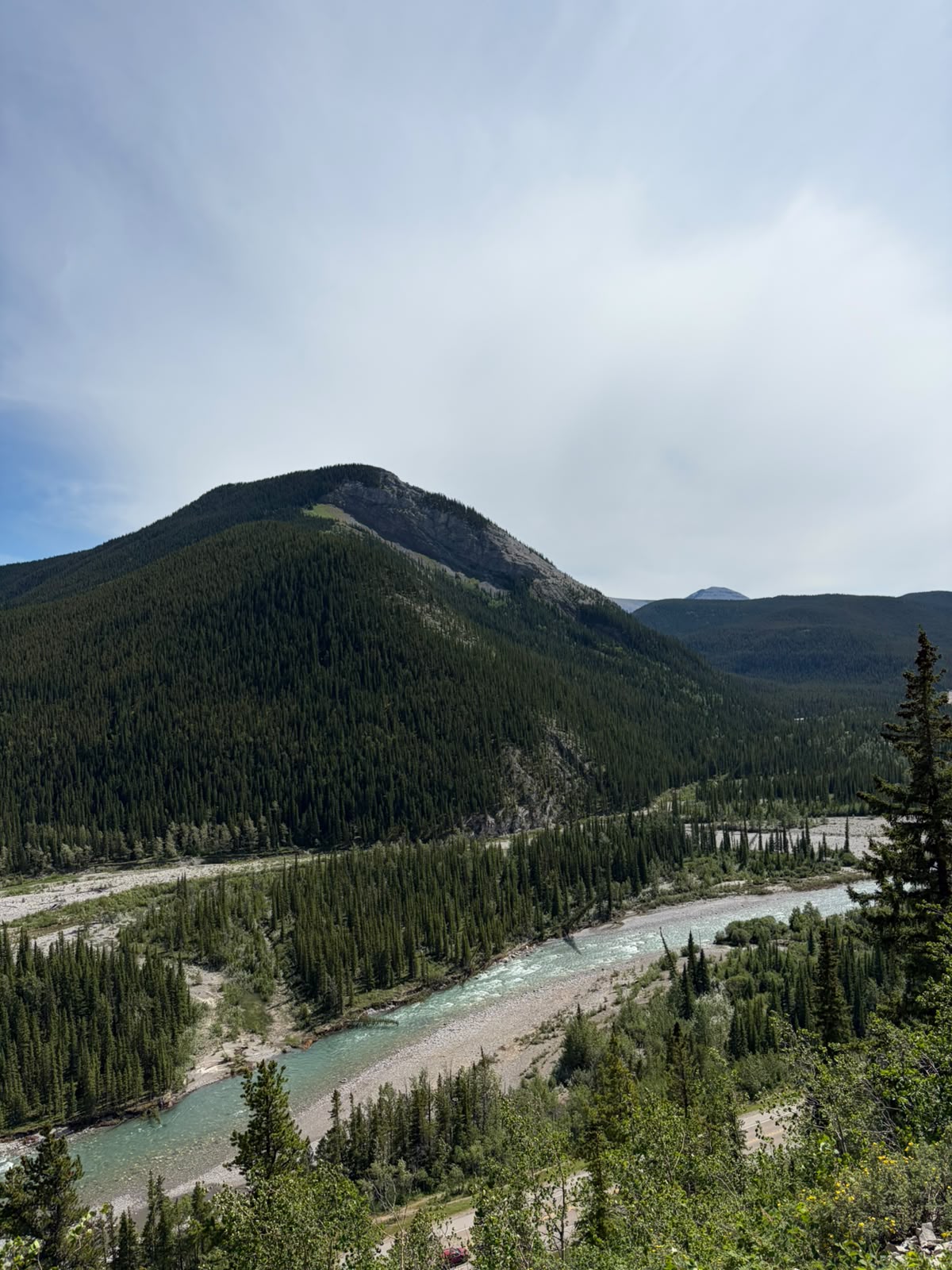 A turquoise river winding through the Rockies