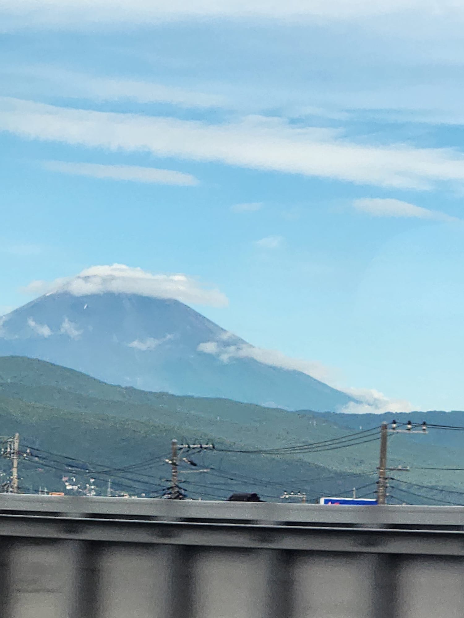 Mount Fuji with a cloud cap, seen from the train